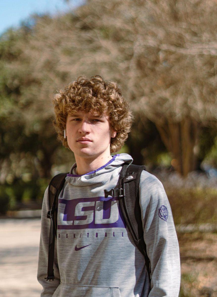 LSU freshman exercise science major Jayden Hans wears a purple and grey LSU sweatshirt on Tuesday, Feb. 8, 2022, near Himes Hall in Baton Rouge, La.