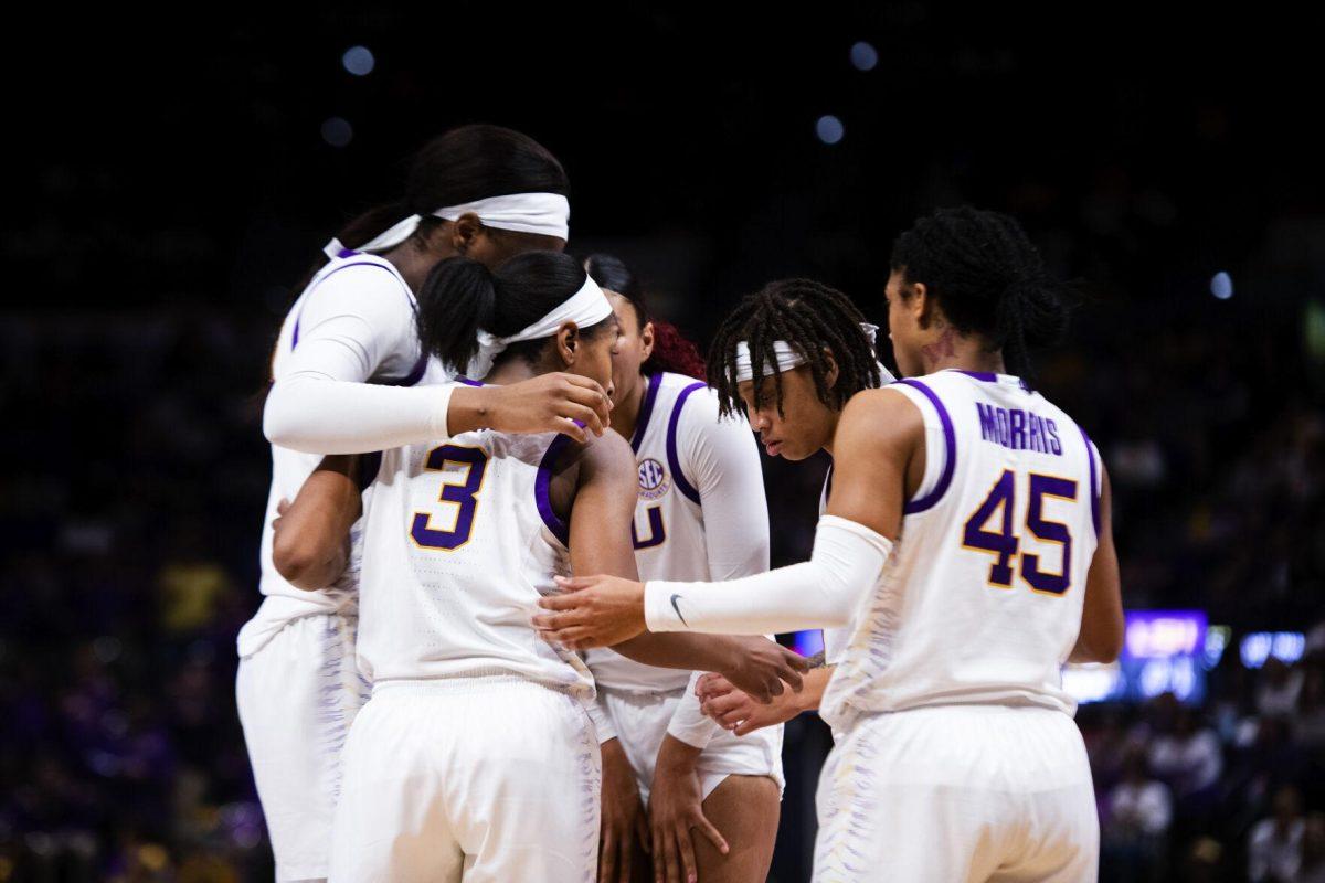 LSU women’s basketball graduate student guard Khayla Pointer (3), fifth year senior guard Alexis Morris (45), graduate student center Faustine Aifuwa (24), graduate student guard Jailin Cherry (1), and graduate student forward Autumn Newby (0) gather around each other Sunday, Feb. 20, 2022, during LSU’s 66-61 win against Florida in the Pete Maravich Assembly Center on North Stadium Drive in Baton Rouge, La.