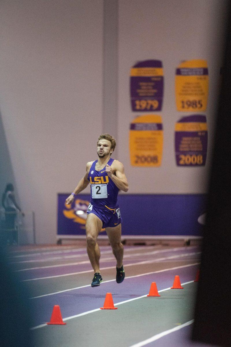 LSU track and field junior Adam Wise powers through the final meters of the race on Friday, Feb. 4, 2022, during the Bayou Bengal indoor track meet at the Carl Maddox Field House on Nicholson Drive in Baton Rouge, La.