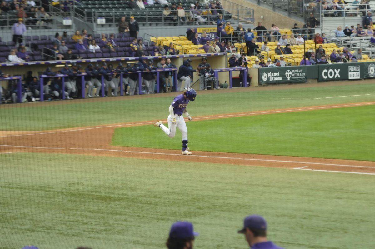 LSU sophomore infielder Jordan Thompson (13) takes the walk to first base Saturday, Feb. 26, 2022, during the Tigers' 9-2 win against Southern University at Alex Box Stadium in Baton Rouge, La.