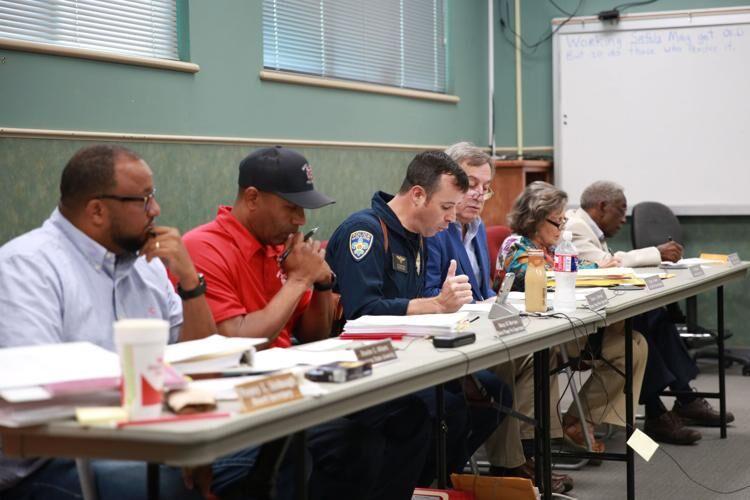 The Civil Service board during its Sept. 19, 2019, meeting. Robert Moruzzi, center, of the Baton Rouge Police Department reads the agenda for the meeting.