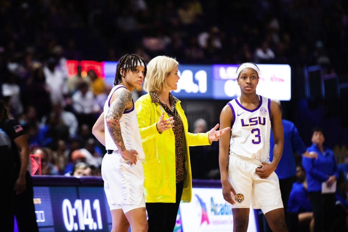 LSU women’s basketball head coach Kim Mulkey speaks to graduate student guard Jailin Cherry (1) and graduate student guard Khayla Pointer (3) Sunday, Feb. 20, 2022, during LSU’s 66-61 win against Florida in the Pete Maravich Assembly Center on North Stadium Drive in Baton Rouge, La.