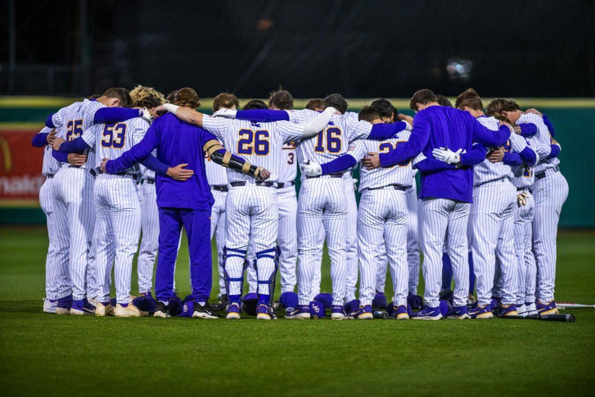 LSU baseball team huddles up in the outfield Friday, Feb. 18, 2022 before LSU's 13-1 win against Maine at Alex Box Stadium on Gourrier Avenue in Baton Rouge, La.