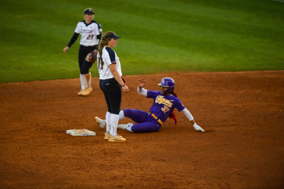 LSU softball sophomore pitcher Morgan Smith (37) slides into second Friday, Feb. 11, 2022, during the Tigers' 3-0 win against South Alabama at Tiger Park in Baton Rouge, La.