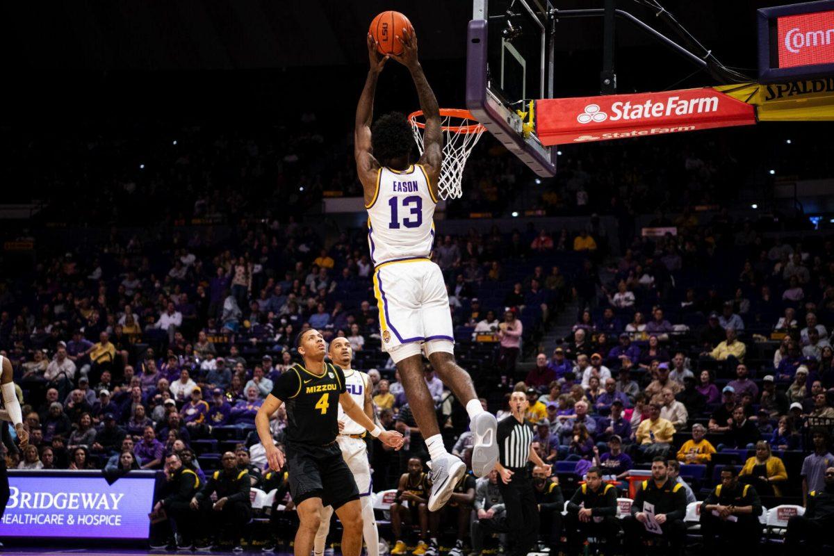 LSU men&#8217;s basketball sophomore forward Tari Eason (13) catches a lob from senior guard Xavier Pinson (1) to dunk the ball Saturday, Feb. 26, 2022, during LSU&#8217;s 75-55 win against Missouri in the Pete Maravich Assembly Center on North Stadium Drive in Baton Rouge, La.