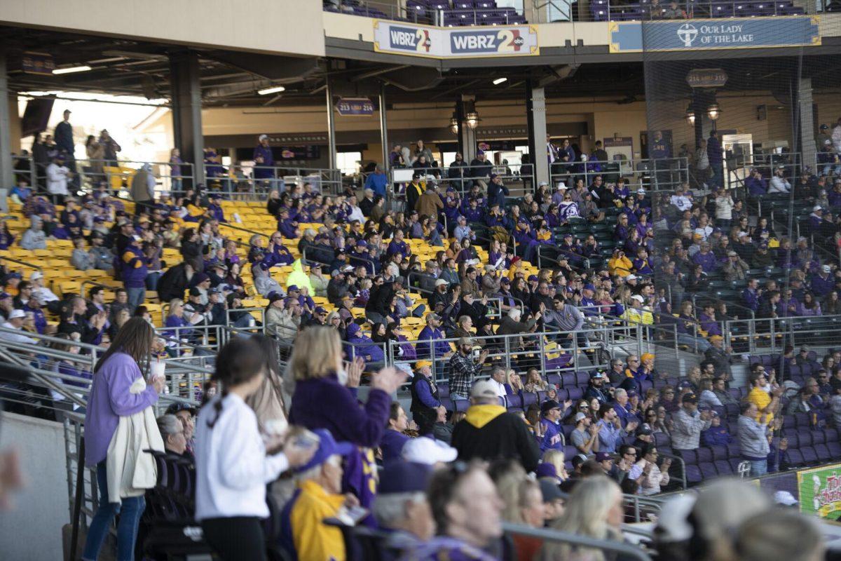 Tiger fans cheer and enjoy the game Saturday, Feb. 19, 2022, during the Tigers' 17-8 win against the University of Maine at Alex Box Stadium in Baton Rouge, La.