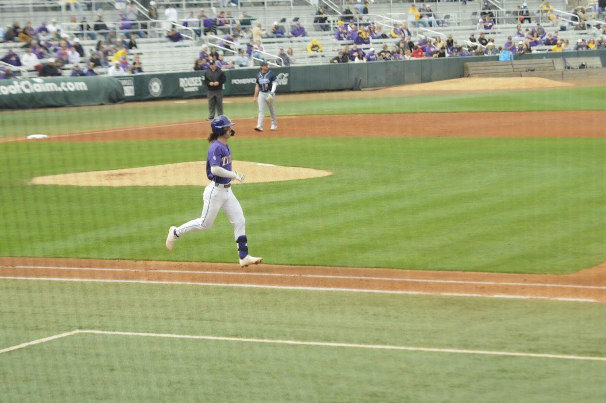 LSU sophomore infielder Jordan Thompson (13) takes the walk to first base Saturday, Feb. 26, 2022, during the Tigers' 9-2 win against Southern University at Alex Box Stadium in Baton Rouge, La.