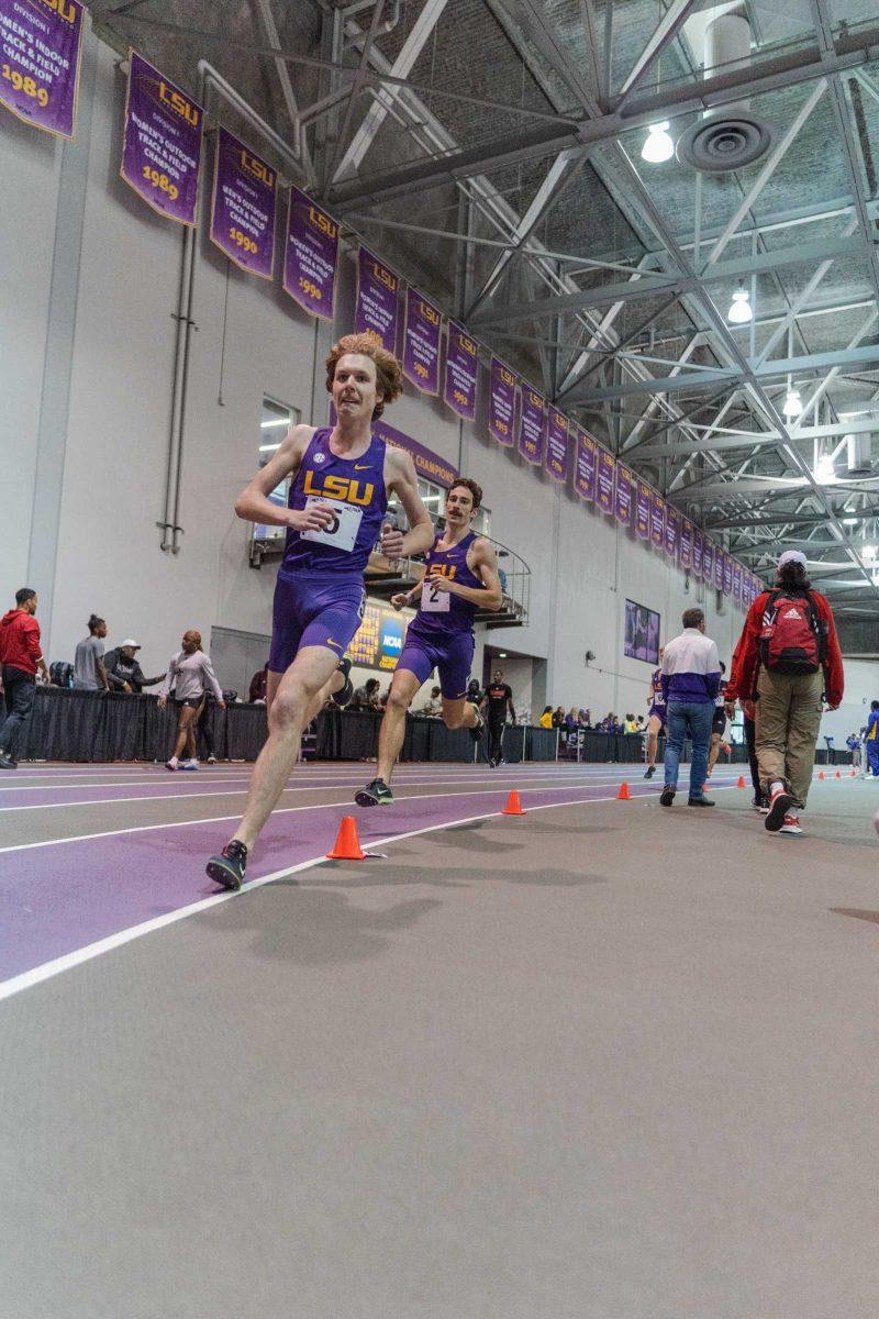 LSU track and field sophomores Cade Martin and Garrett Hamilton run into the curve on Friday, Feb. 4, 2022, during the Bayou Bengal indoor track meet at the Carl Maddox Field House on Nicholson Drive in Baton Rouge, La.