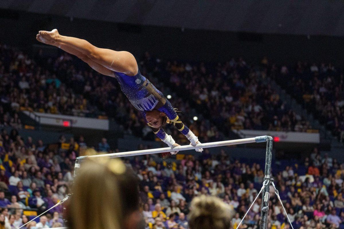 LSU gymnastics all-around freshman Aleah Finnegan spins on the uneven bars on Friday, March 4, 2022, during LSU gymnastics&#8217; 107.500-197.450 loss against Kentucky in the Pete Maravich Assembly Center on North Stadium Drive in Baton Rouge, La.