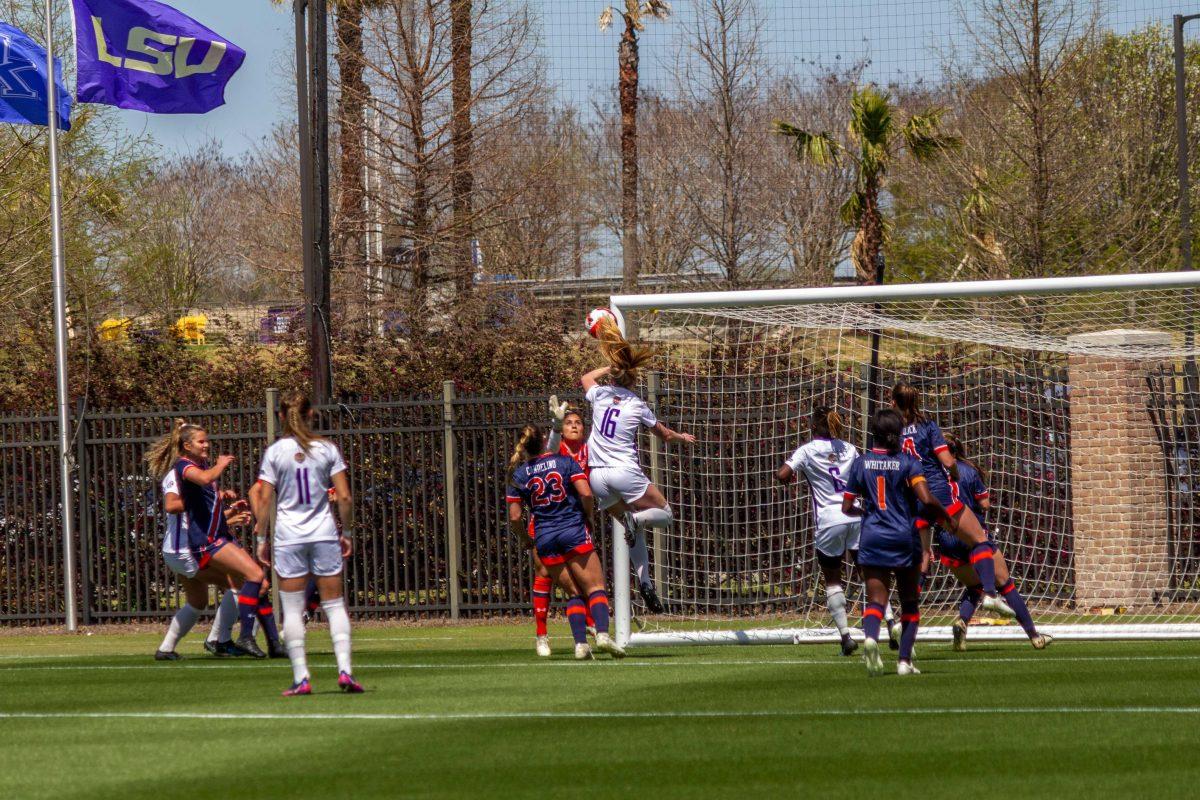 LSU soccer defense 5th-year senior Lindsi Jennings (16) heads the ball into the hands of the Auburn goalkeeper Saturday, March 26, 2022, during LSU soccer's exhibition match against Auburn at LSU's Soccer Stadium off of Nicholson Drive.