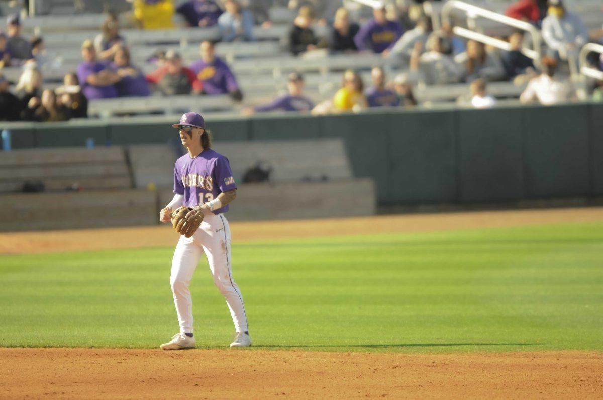 LSU sophomore infielder Jordan Thompson (13) watches the pitch Saturday, Feb. 26, 2022, during the Tigers' 9-2 win against Southern University at Alex Box Stadium in Baton Rouge, La.