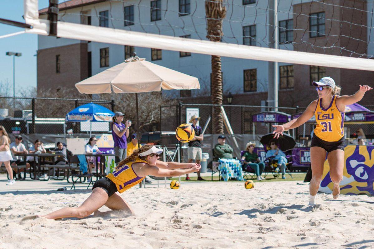 LSU beach volleyball freshman Cassidy Chambers (21) reaches for the ball on Sunday, March 27, 2022, during LSU&#8217;s 1-4 loss against TCU at the Beach Volleyball Stadium on Cypress Drive in Baton Rouge, La.