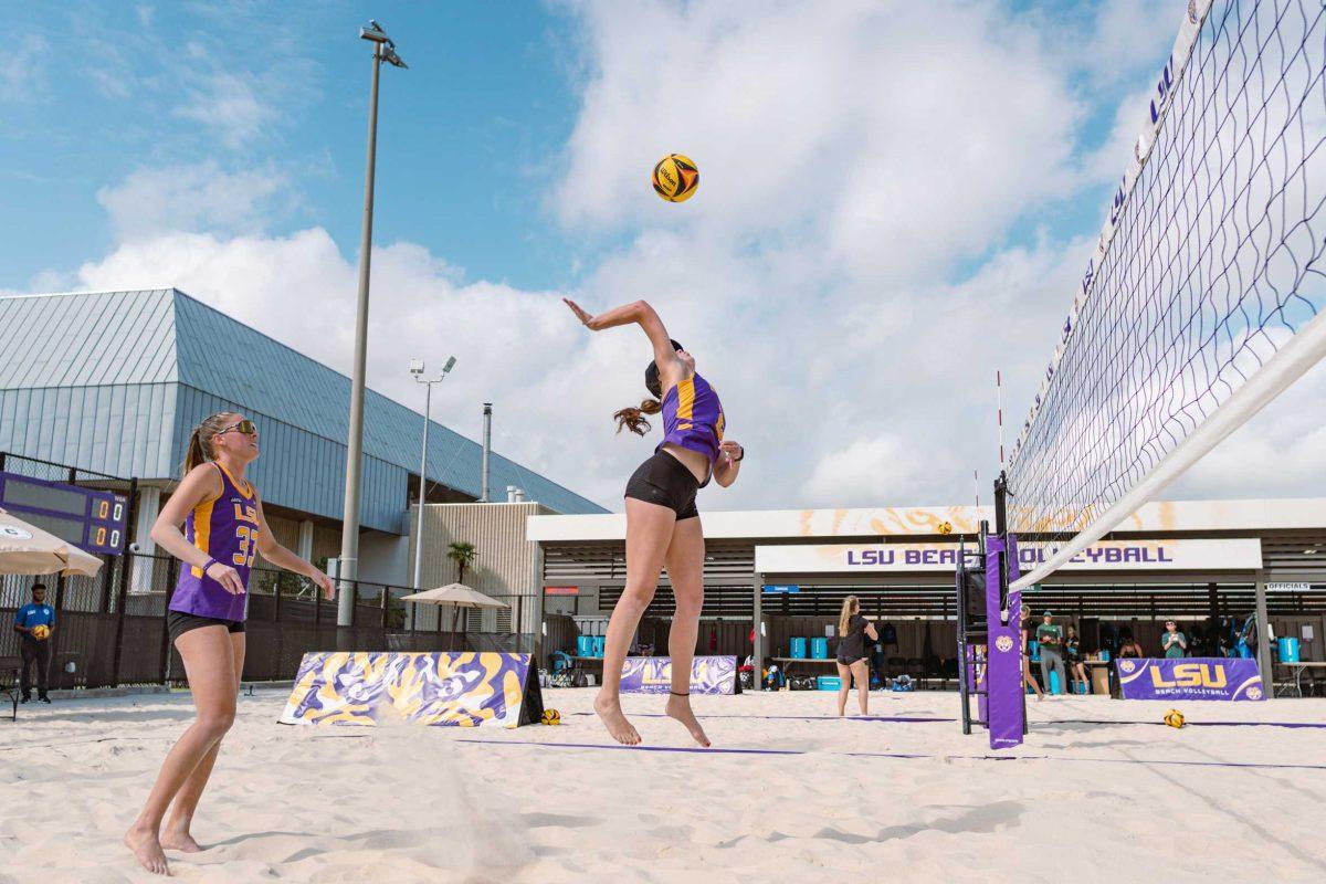 LSU beach volleyball graduate student Allison Coens (2) jumps for the ball on Sunday, March 6, 2022, during LSU&#8217;s 3-2 win over Loyola Marymount at the Beach Volleyball Stadium on Cypress Drive in Baton Rouge, La.