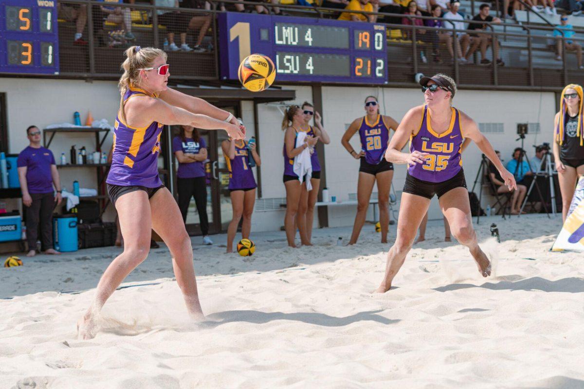 LSU beach volleyball sophomore Ellie Shank (15) receives the serve on Sunday, March 6, 2022, during LSU&#8217;s 3-2 win over Loyola Marymount at the Beach Volleyball Stadium on Cypress Drive in Baton Rouge, La.