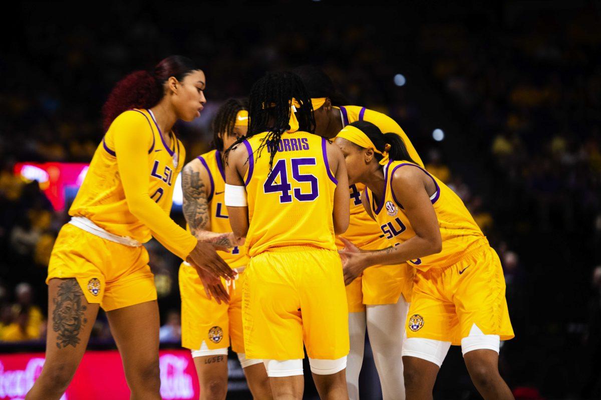 LSU women&#8217;s basketball graduate student guard Khayla Pointer (3), fifth year senior guard Alexis Morris (45), graduate student forward Autumn Newby (0), graduate student guard Jailin Cherry (1), and graduate student center Faustine Aifuwa (24) huddle up Thursday, Feb. 24, 2022, during LSU&#8217;s Senior Night 58-50 win against Alabama in the Pete Maravich Assembly Center on North Stadium Drive in Baton Rouge, La.