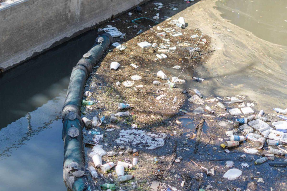 Garbage collects at the end of the Corporation Canal on Thursday, March 10, 2022, near East Chimes Street in Baton Rouge, La.