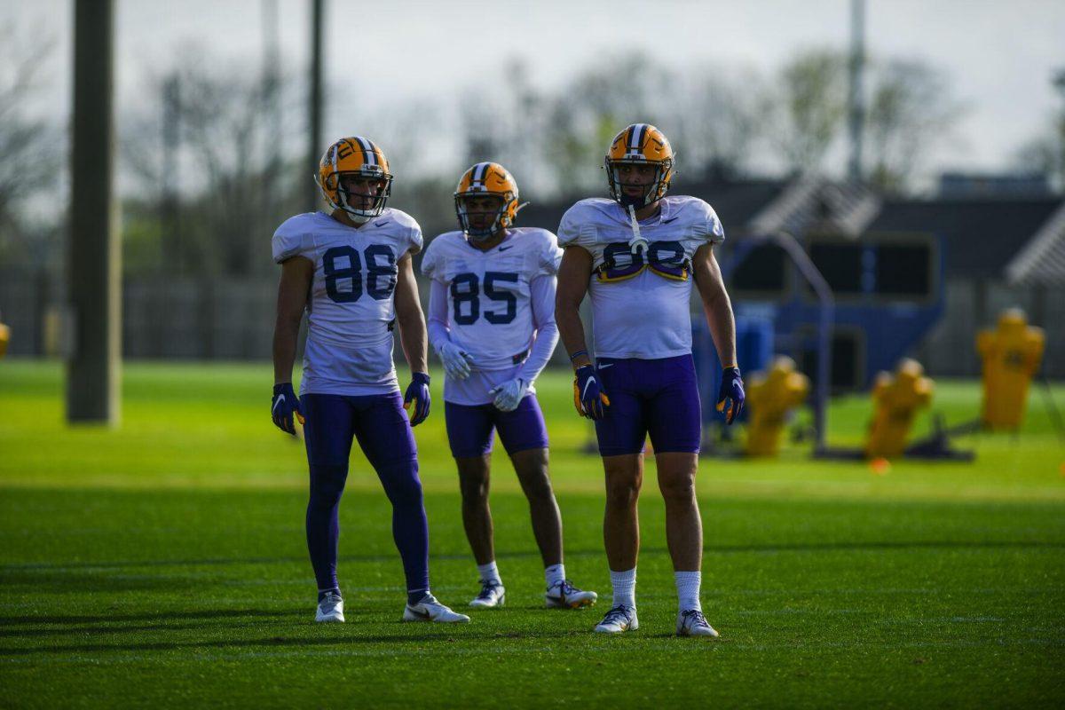 LSU football wide receivers Evan Francioni (88), LJ Gilyot (85), and Jack Bech (80) wait for the next drill Tuesday, March 29, 2022 during LSU's spring practice in Baton Rouge, La.