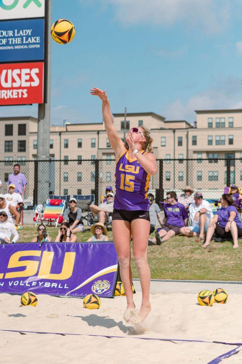 LSU beach volleyball sophomore Ellie Shank (15) serves the ball on Sunday, March 6, 2022, during LSU&#8217;s 3-2 win over Loyola Marymount at the Beach Volleyball Stadium on Cypress Drive in Baton Rouge, La.