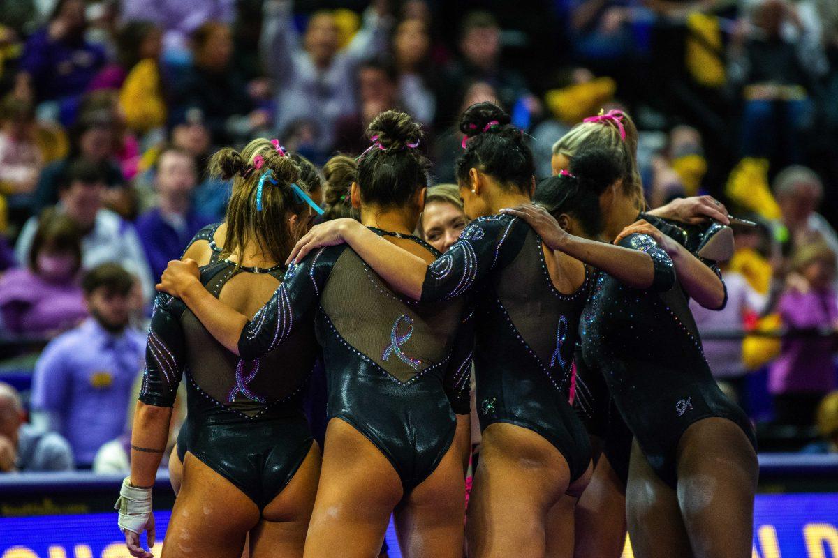 LSU gymnastics team huddles up Saturday, Feb. 5, 2022 during LSU's 197.975-197.750 win over Auburn in the Pete Maravich Assembly Center on N. Stadium Drive in Baton Rouge, La.