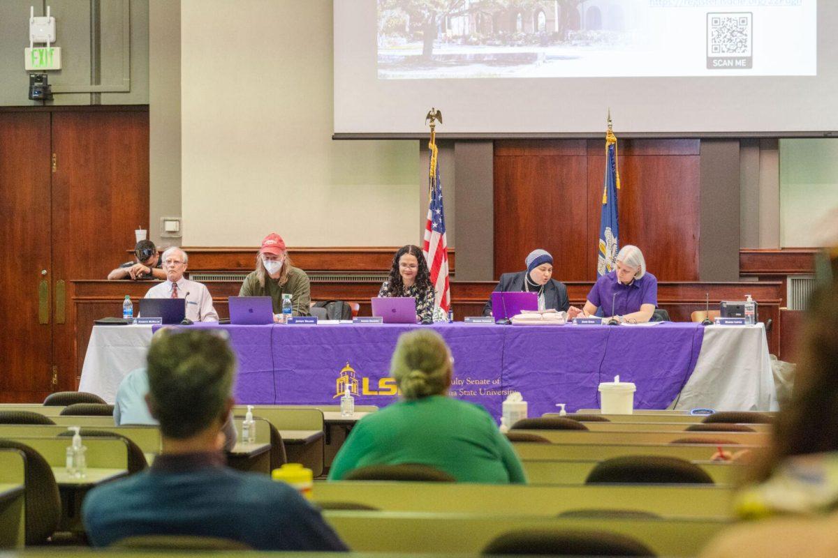 Members of the LSU Faculty Senate Executive Committee make notes on their laptops on Thursday, March 24, 2022, inside the LSU Law Center on Highland Road in Baton Rouge, La.