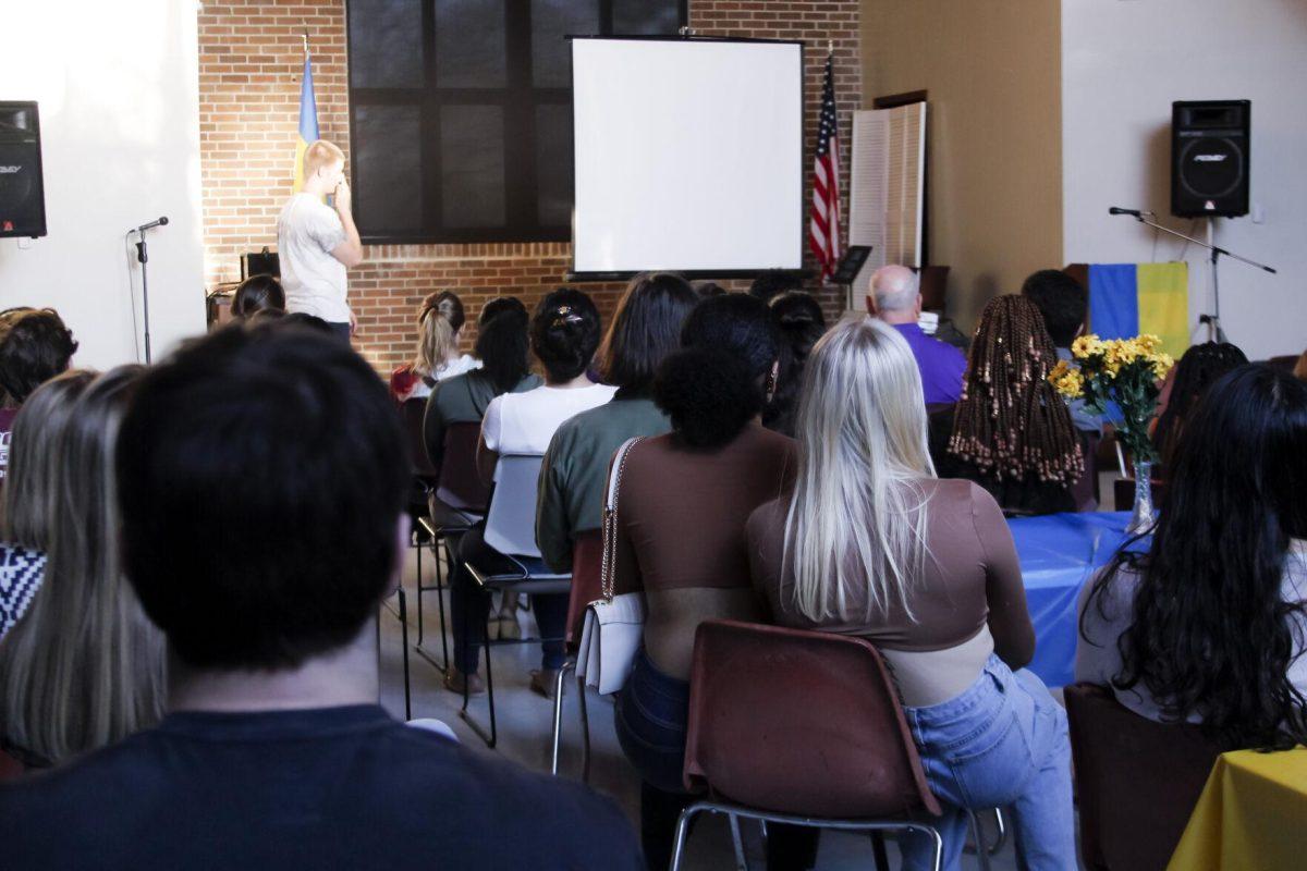 The crowd watches a video Friday, March 4, 2022 at the for the Ukraine supoort event at the LSU International Cultural Center on Dalrymple Drive in Baton Rouge, La.