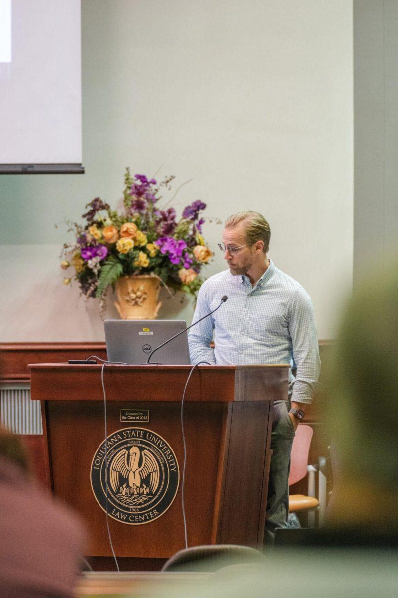 LSU Faculty Senator Roy Heidelberg reads a resolution on Thursday, March 24, 2022, inside the LSU Law Center on Highland Road in Baton Rouge, La.