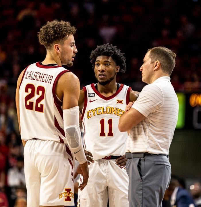 Tyrese Hunter, Gabe Kalscheur and TJ Otzelberger huddle up during a game for Iowa State. (Iowa State Daily/Collin Maguire)&#160;