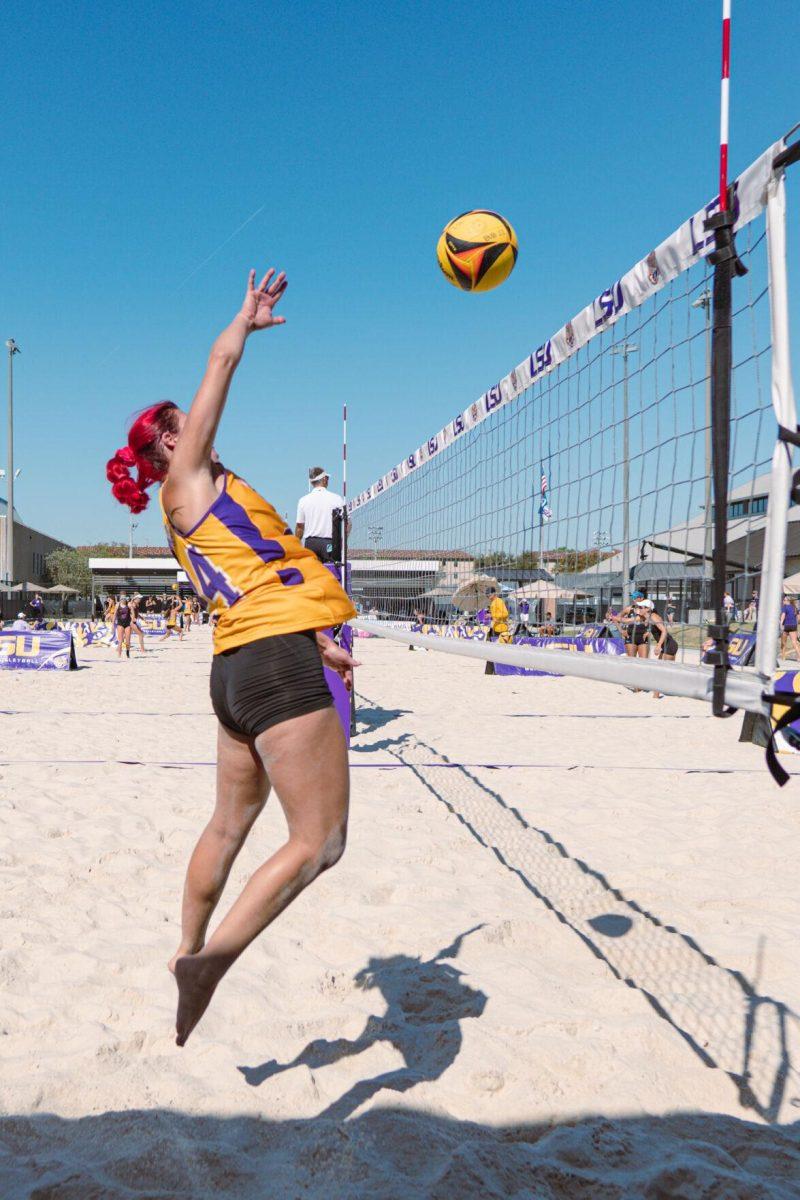 LSU beach volleyball senior Alexis Toney (24) smacks the ball over the net on Sunday, March 27, 2022, during LSU&#8217;s 1-4 loss against TCU at the Beach Volleyball Stadium on Cypress Drive in Baton Rouge, La.