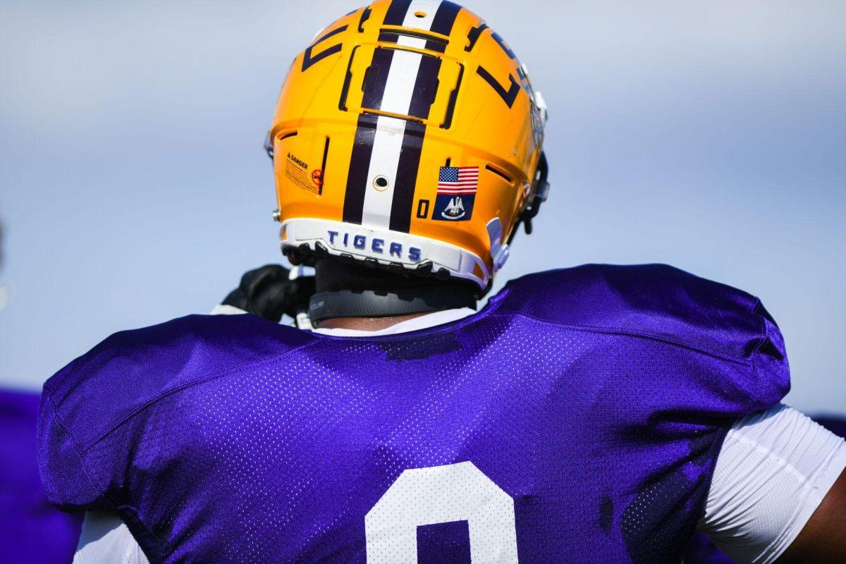 LSU football defensive lineman Maason Smith (0) stands on the sidelines Tuesday, March 29, 2022 during LSU's spring practice in Baton Rouge, La.