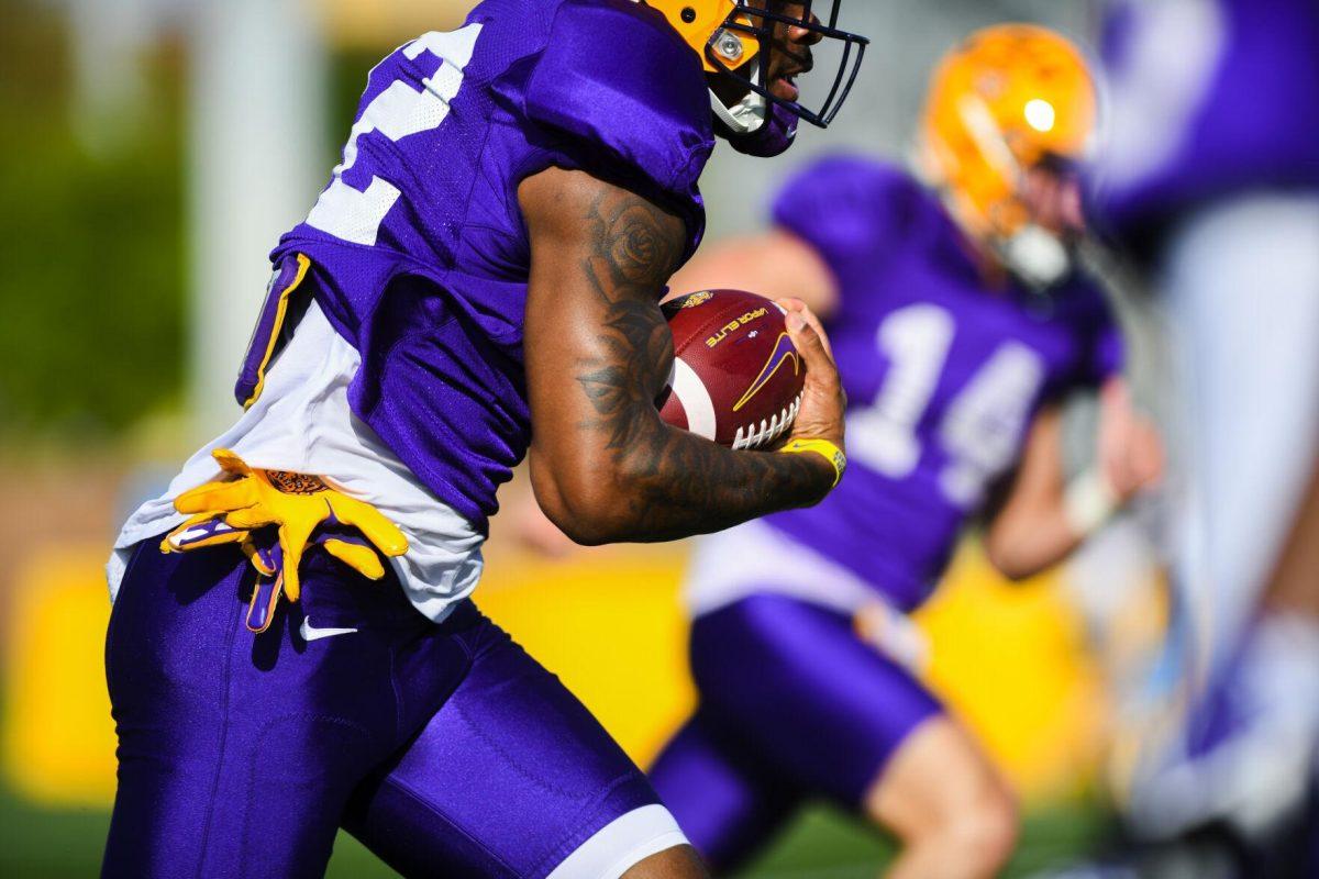 LSU football junior cornerback Mekhi Garner (22) runs the ball Tuesday, March 29, 2022 during LSU's spring practice in Baton Rouge, La.