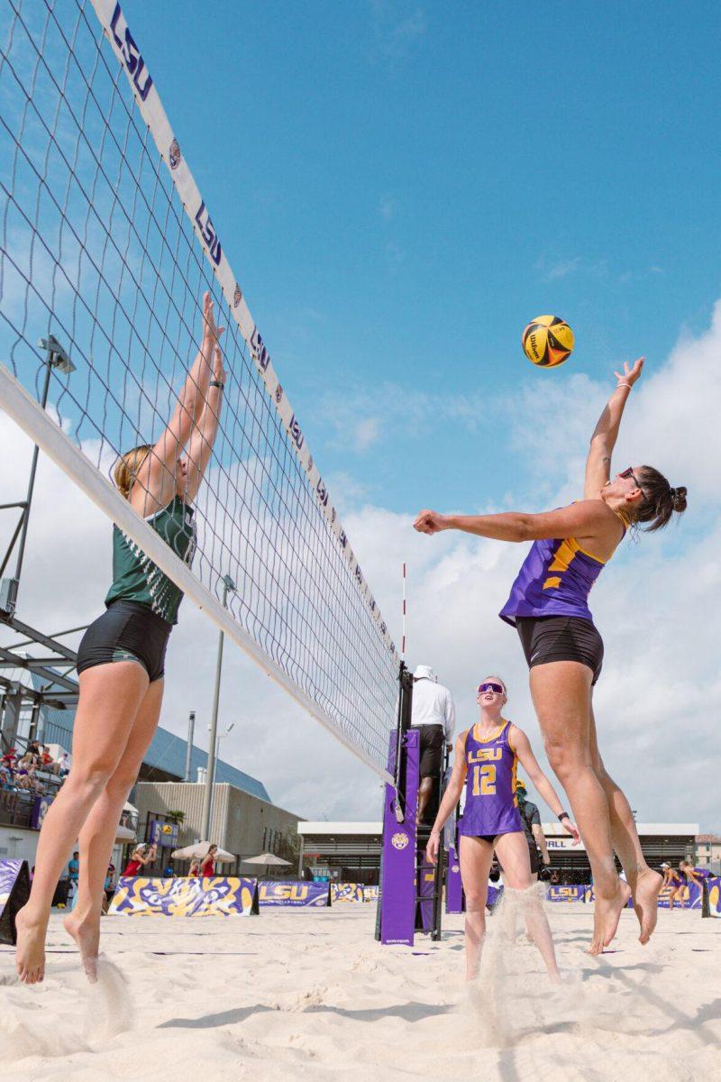 LSU beach volleyball junior Elizabeth Masters (8) jumps to hit the ball on Sunday, March 6, 2022, during LSU&#8217;s 3-2 win over Loyola Marymount at the Beach Volleyball Stadium on Cypress Drive in Baton Rouge, La.