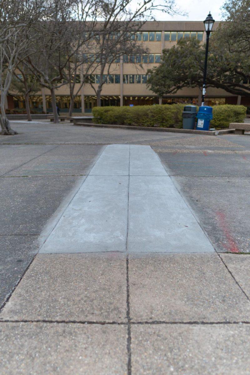 A strip of new concrete replaces the old one on Monday, March 7, 2022, in the LSU Quad in Baton Rouge, La.