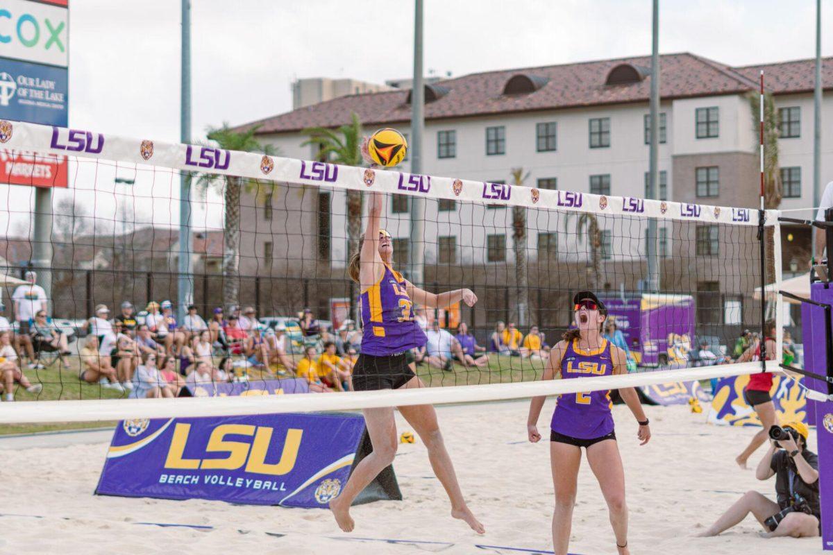 LSU beach volleyball junior Lara Boos (33) taps the ball on Sunday, March 6, 2022, during LSU&#8217;s 3-2 win over Loyola Marymount at the Beach Volleyball Stadium on Cypress Drive in Baton Rouge, La.