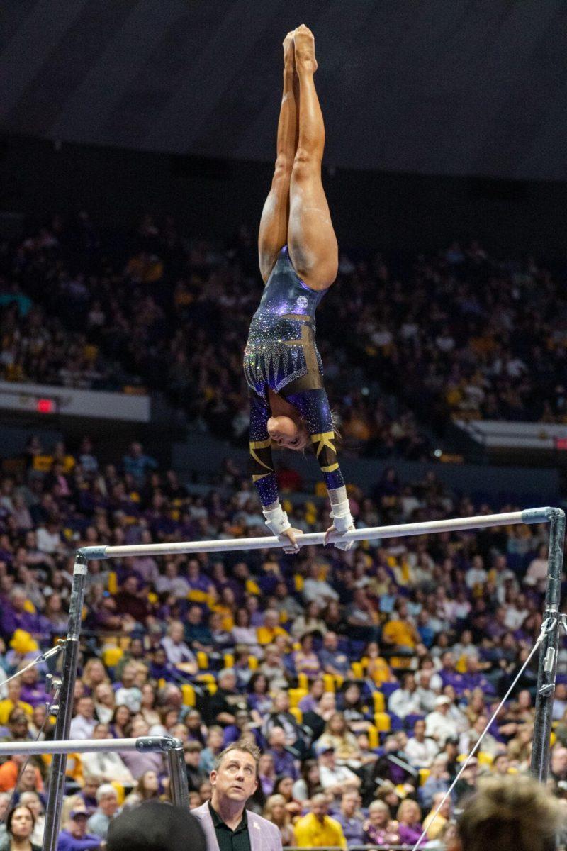 LSU gymnastics all-around freshman Aleah Finnegan spins on the uneven bars on Friday, March 4, 2022, during LSU gymnastics&#8217; 107.500-197.450 loss against Kentucky in the Pete Maravich Assembly Center on North Stadium Drive in Baton Rouge, La.