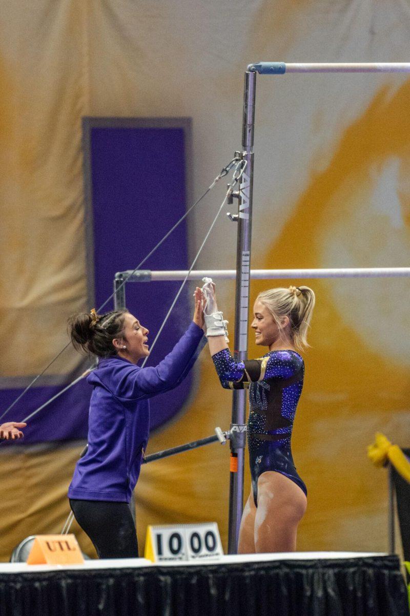 LSU gymnastics all-around sophomore Olivia Dunne high-fives her teammate on Friday, March 4, 2022, during LSU gymnastics&#8217; 107.500-197.450 loss against Kentucky in the Pete Maravich Assembly Center on North Stadium Drive in Baton Rouge, La.