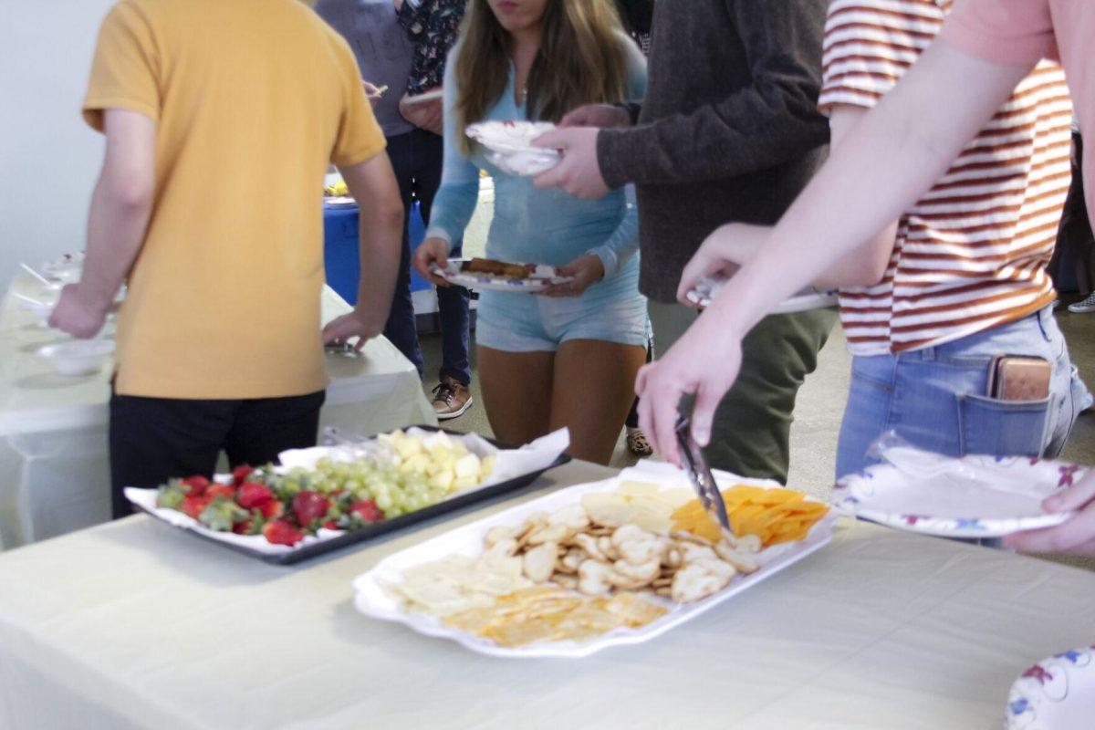 Audience memebers help themselves to refreshments Friday, March 4, 2022 at the for the Ukraine supoort event at the LSU International Cultural Center on Dalrymple Drive in Baton Rouge, La.