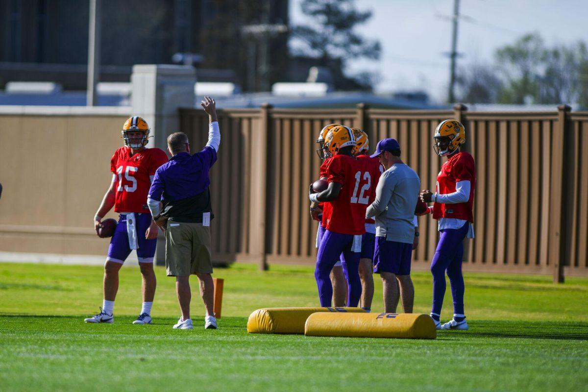 LSU head coach Brian Kelly speaks to the quarterbacks Tuesday, March 29, 2022 during LSU's spring practice in Baton Rouge, La.