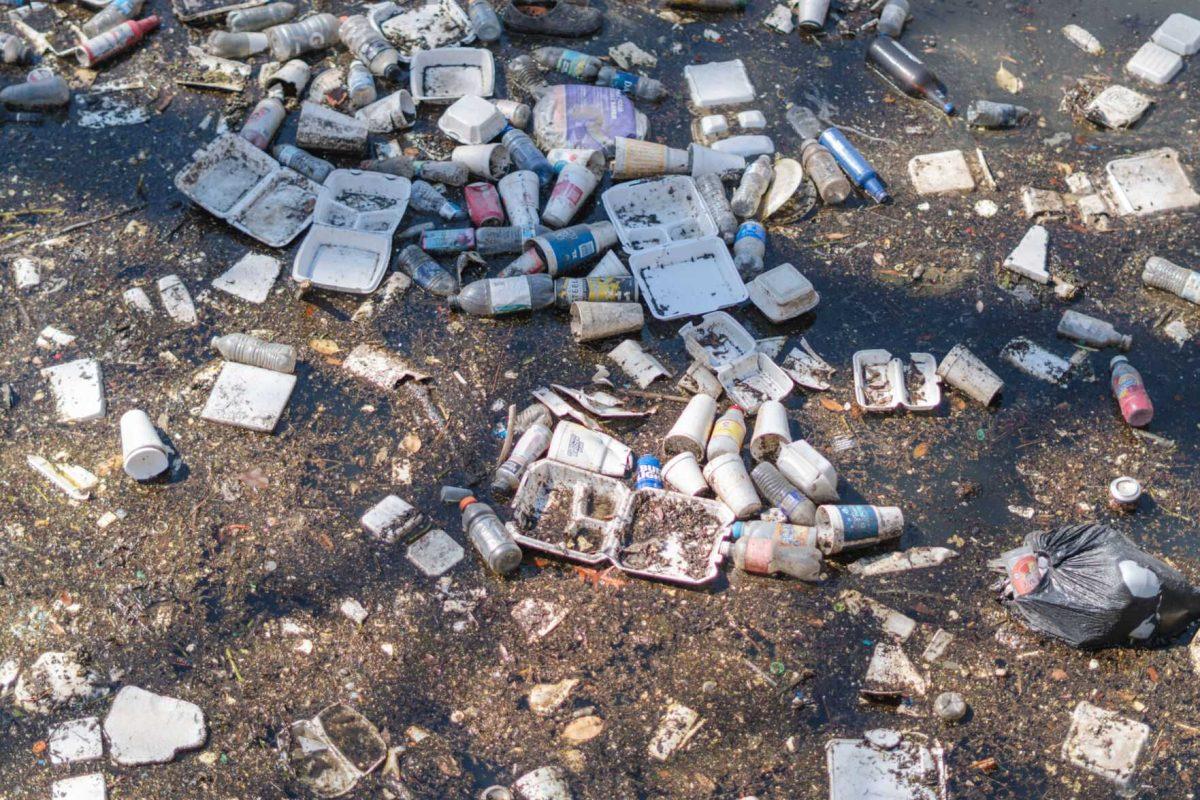 Garbage collects at the end of the Corporation Canal on Thursday, March 10, 2022, near East Chimes Street in Baton Rouge, La.