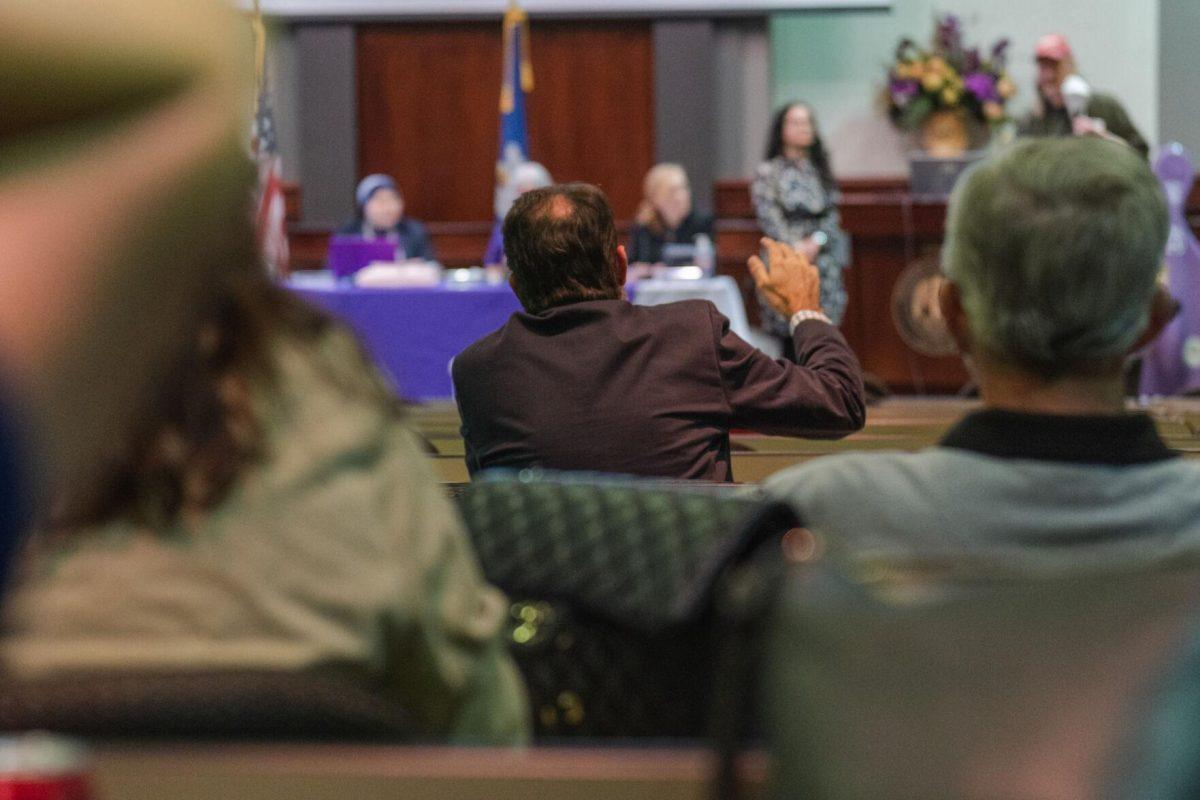 A Faculty Senator raises a hand on Thursday, March 24, 2022, inside the LSU Law Center on Highland Road in Baton Rouge, La.