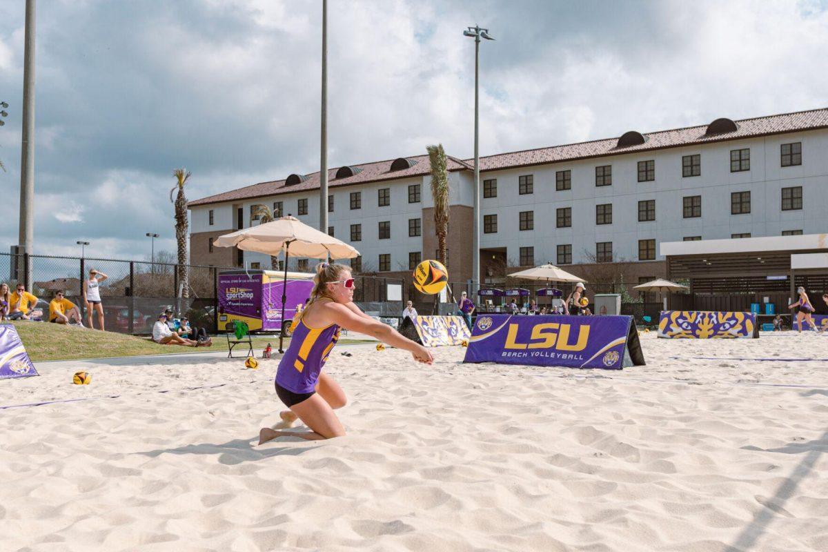 LSU beach volleyball sophomore Ellie Shank (15) hits the ball upward on Sunday, March 6, 2022, during LSU&#8217;s 3-2 win over Loyola Marymount at the Beach Volleyball Stadium on Cypress Drive in Baton Rouge, La.