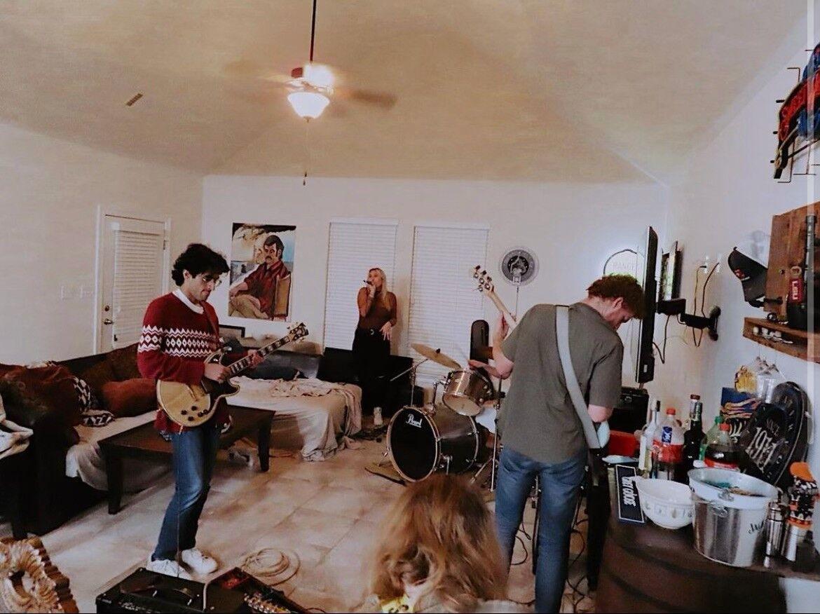 Hamood Qureshi, far left, plays guitar at a rehearsal with his band Rick'o'Shea.&#160;