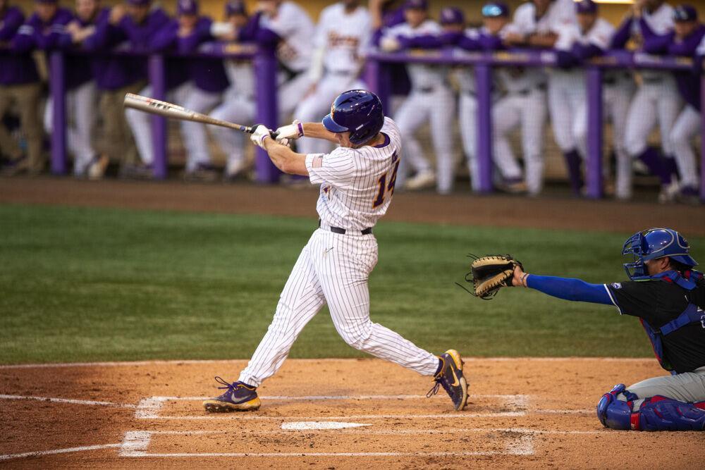 LSU baseball sophomore infield Jacob Berry (14) hits a fly ball towards the outfield Wednesday, March. 23, 2022 during LSU's 6-7 loss against Louisiana Tech at Alex Box Stadium on Gourrier Avenue in Baton Rouge, La.