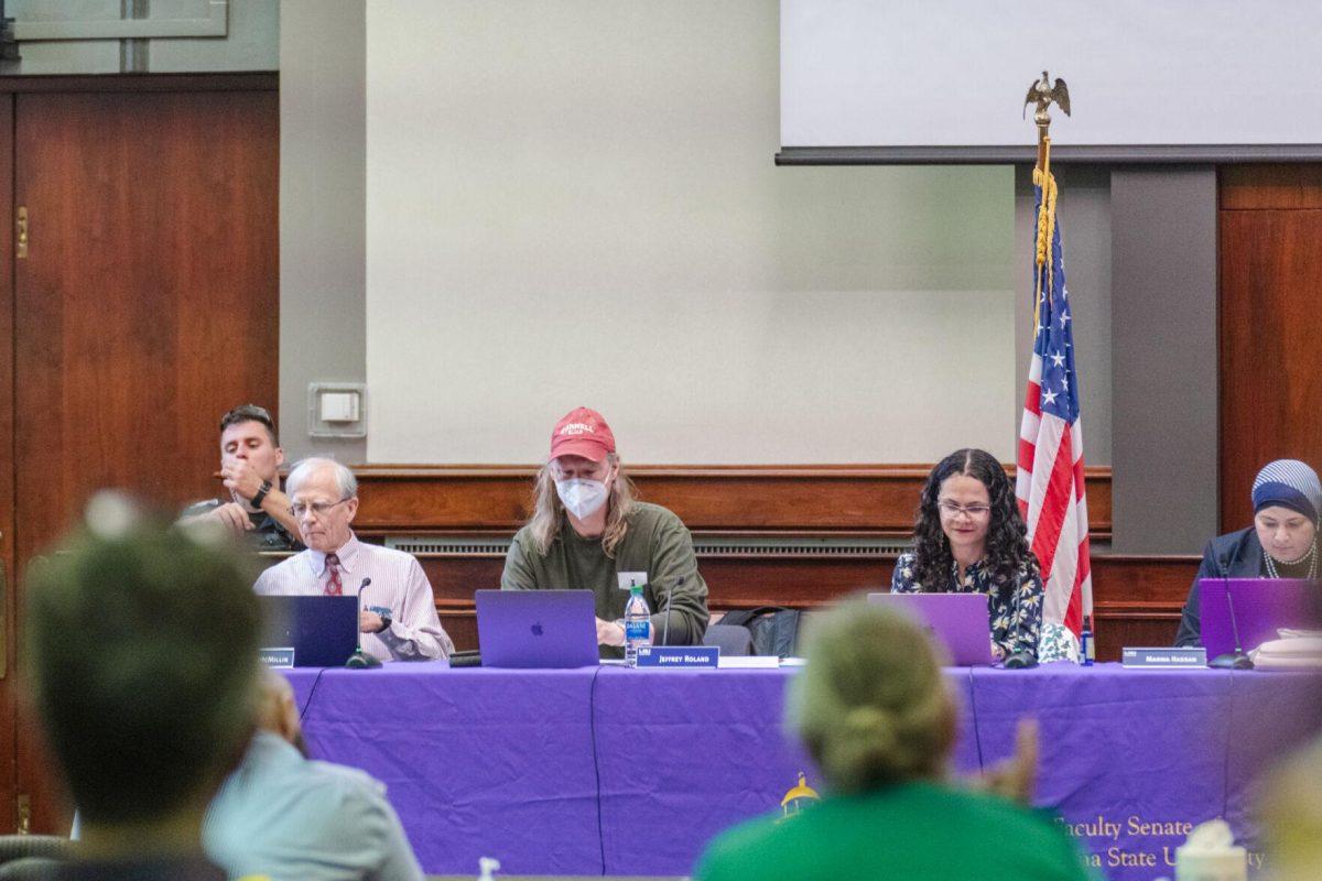 Members of the LSU Faculty Senate Executive Committee make notes on their laptops on Thursday, March 24, 2022, inside the LSU Law Center on Highland Road in Baton Rouge, La.