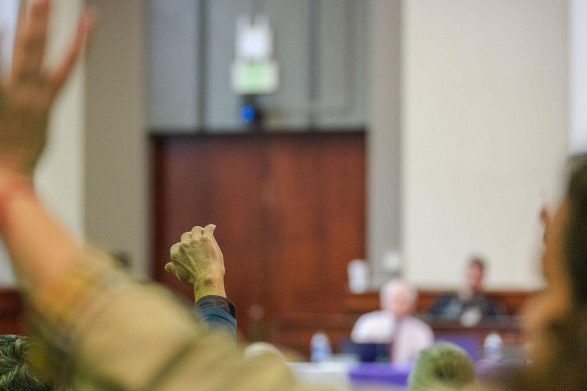 Hands rise up during a vote on a Faculty Senate Resolution on Thursday, March 24, 2022, inside the LSU Law Center on Highland Road in Baton Rouge, La.