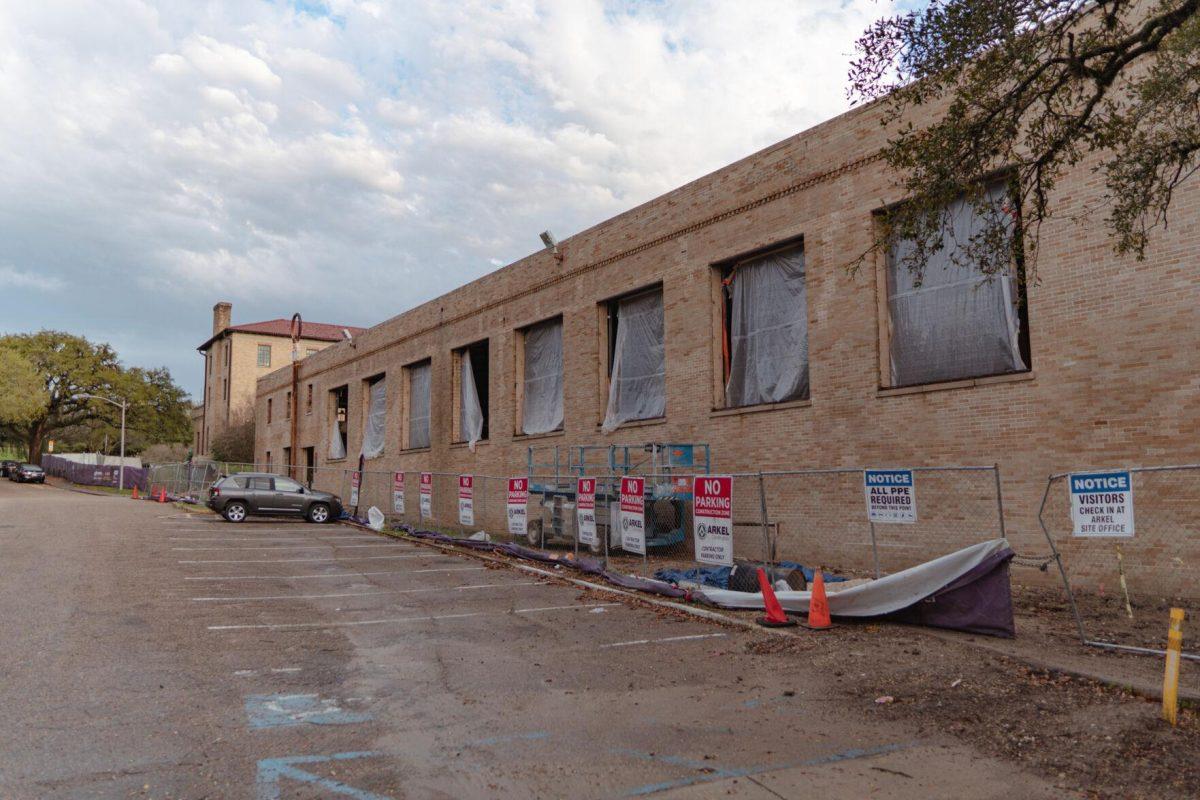 Tarps hang in the empty windows of the old pool on Tuesday, March 22, 2022, at the Huey P. Long Field House on Field House Drive in Baton Rouge, La.