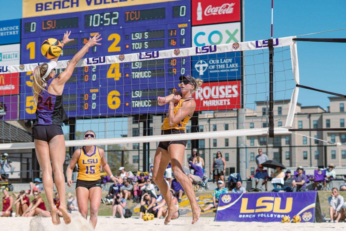 LSU beach volleyball redshirt sophomore Sierra Caffo (35) smacks the ball through the defender&#8217;s block on Sunday, March 27, 2022, during LSU&#8217;s 1-4 loss against TCU at the Beach Volleyball Stadium on Cypress Drive in Baton Rouge, La.