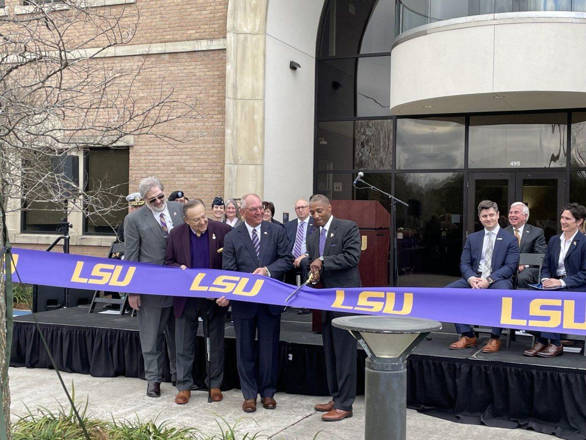 LSU President William Tate IV, Louisiana Gov. John Bel Edwards, LSU Board of Supervisor Chair Remy Starnes and Louisiana Board of Regents member Richard Lipsey cut a ribbon on Wednesday March 16 at an event announced new LSU cybersecurity and defense initiatives