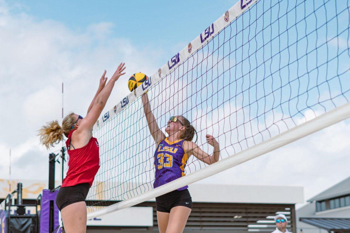 LSU beach volleyball junior Lara Boos (33) leaps up for the ball on Sunday, March 6, 2022, during LSU&#8217;s 3-2 win over Loyola Marymount at the Beach Volleyball Stadium on Cypress Drive in Baton Rouge, La.