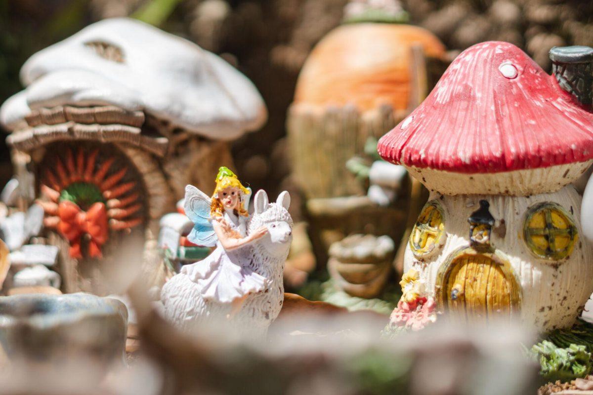 A fairy rides into town on its alpaca on Thursday, March 24, 2022, to give Dog its treat in the Fairy Garden on LSU&#8217;s campus in Baton Rouge, La.