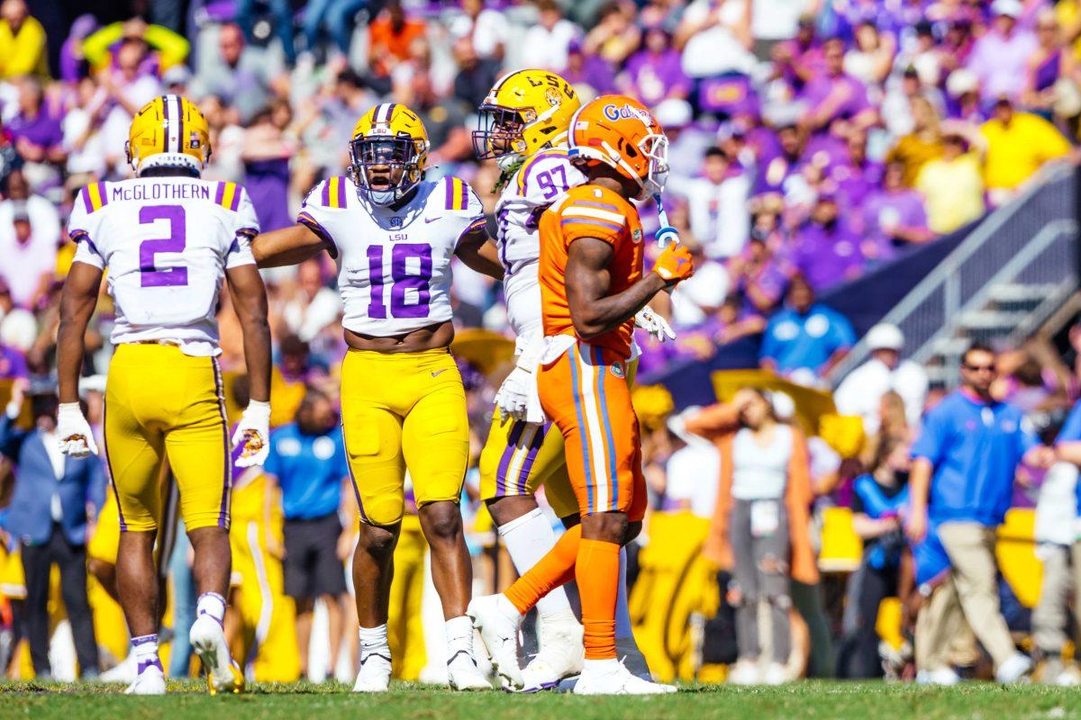 LSU football senior linebacker Damone Clark (18) speaks to his teammates Saturday, Oct. 16, 2021, during LSU's 49-42 win against Florida at Tiger Stadium in Baton Rouge, La.